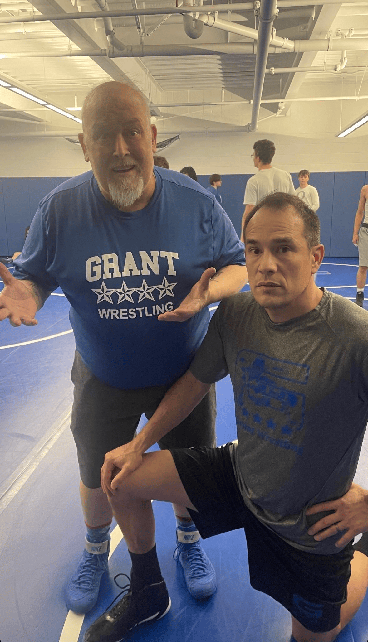 Coach Aaron Long and Coach Warren McPherson in the Grant wrestling room